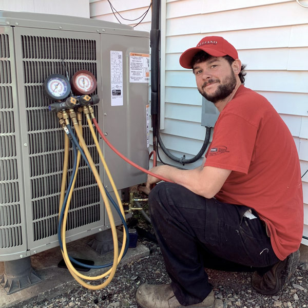 Technician working on an air conditioner